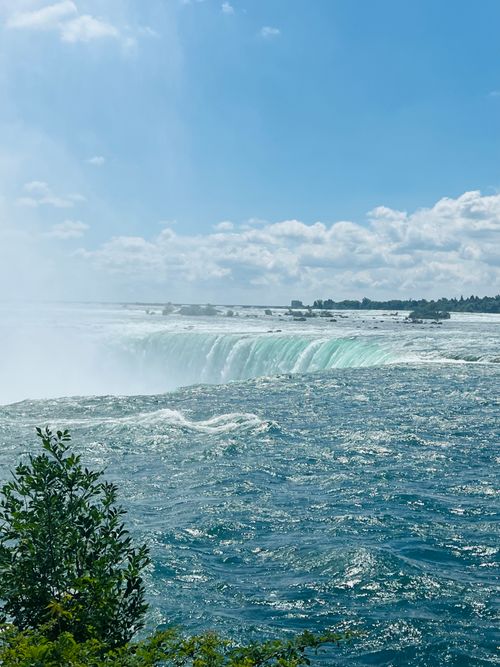 Free Stunning vista of Niagara Falls with a clear blue sky and vibrant waters, captured in Toronto, ON, Canada. Stock Photo