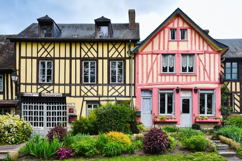 Free Colorful timber-framed houses in Normandy showcasing classic European architecture. Stock Photo
