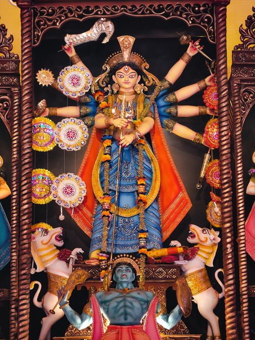 Free Colorful Durga idol with ten arms at a Kolkata festival showcasing rich cultural craftsmanship. Stock Photo