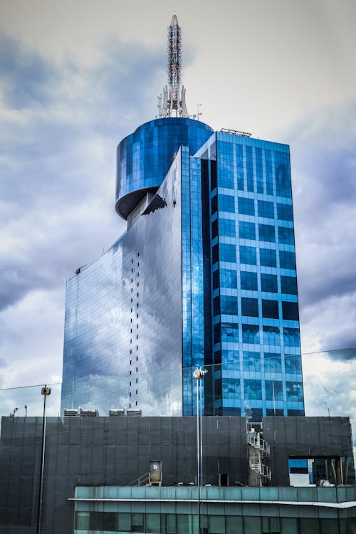 Blue Glass Walled High Rise Building · Free Stock Photo