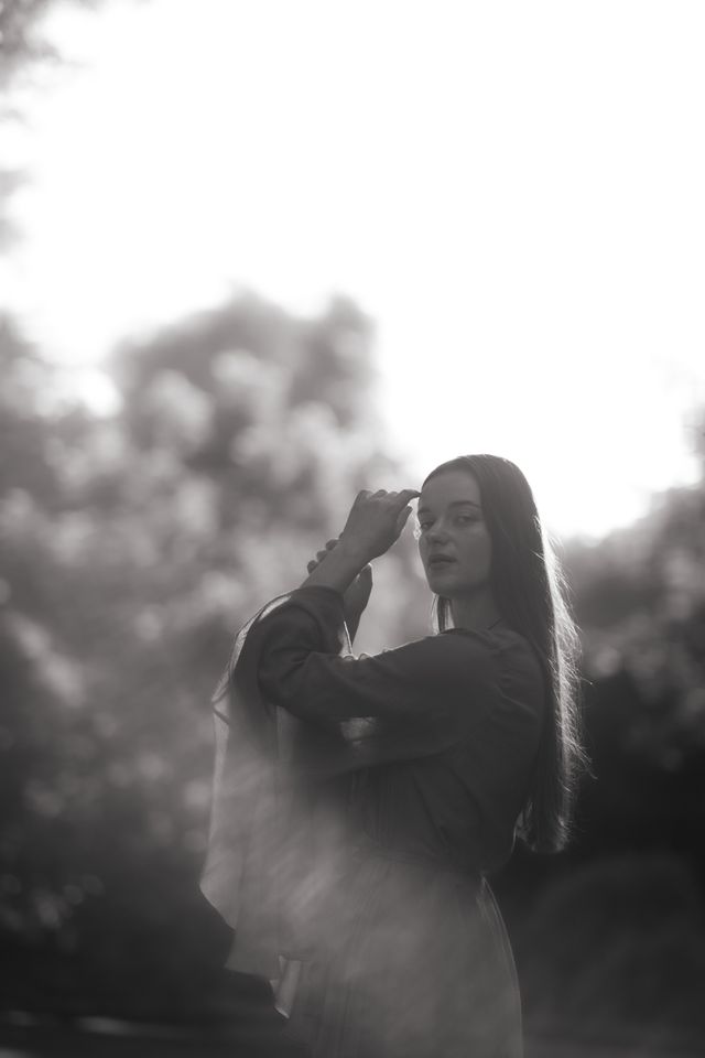 A woman photographed through soft haze — photo by Alina Chernii on Pexels