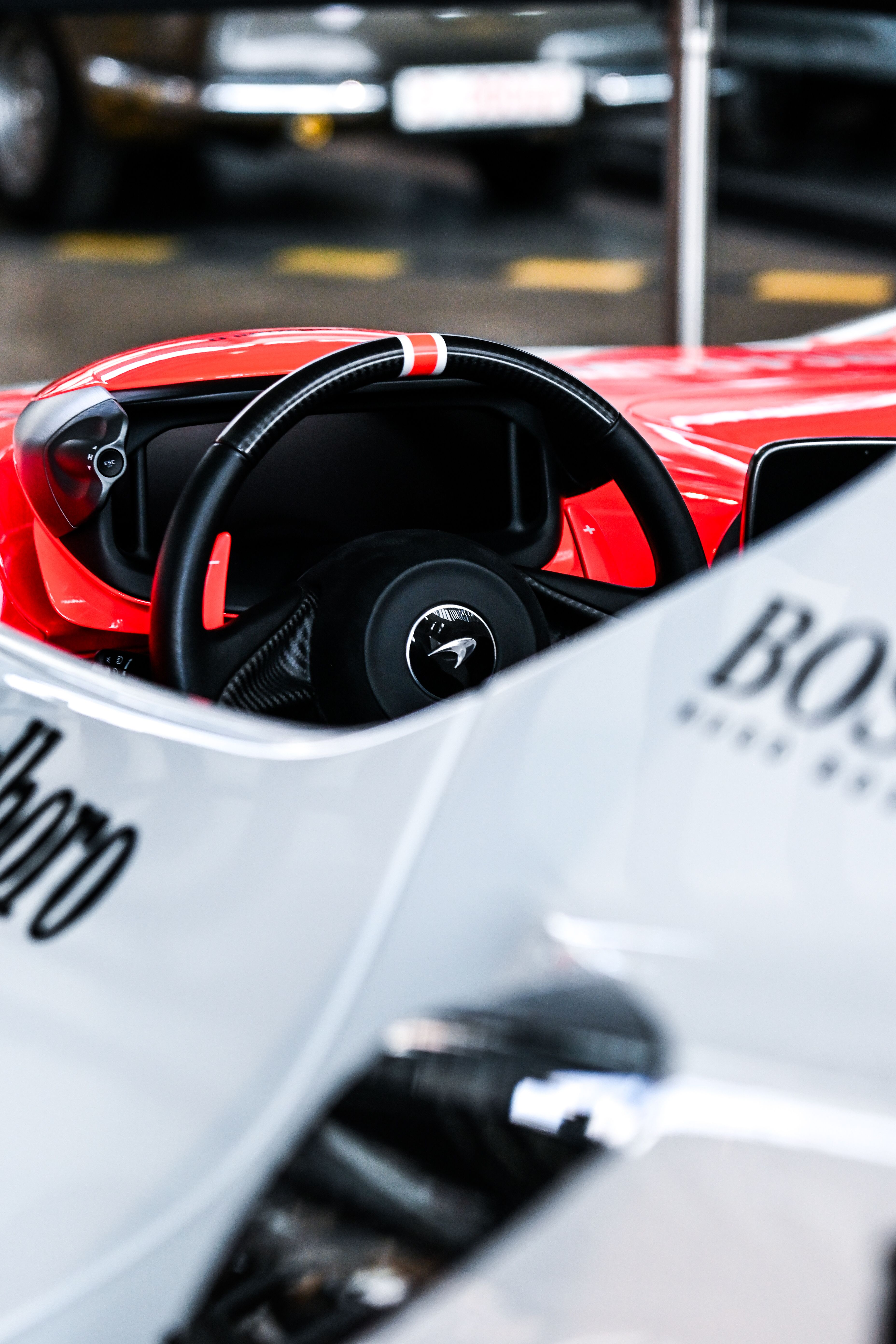 A close up of a red and white racing car · Free Stock Photo