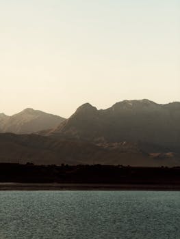 Tranquil landscape of mountains and water during dawn in Kurdistan, Iraq.