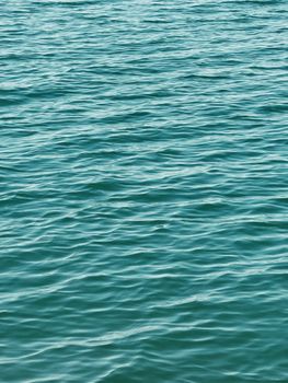 Serene turquoise waves captured in Ranya, Iraq, showcasing summer's beauty.