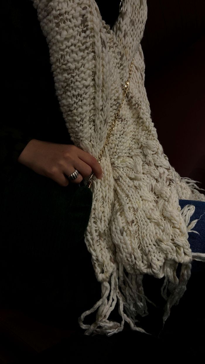Close-up of a cream hand-knit wool scarf — photo by Merve YAYLA on Pexels