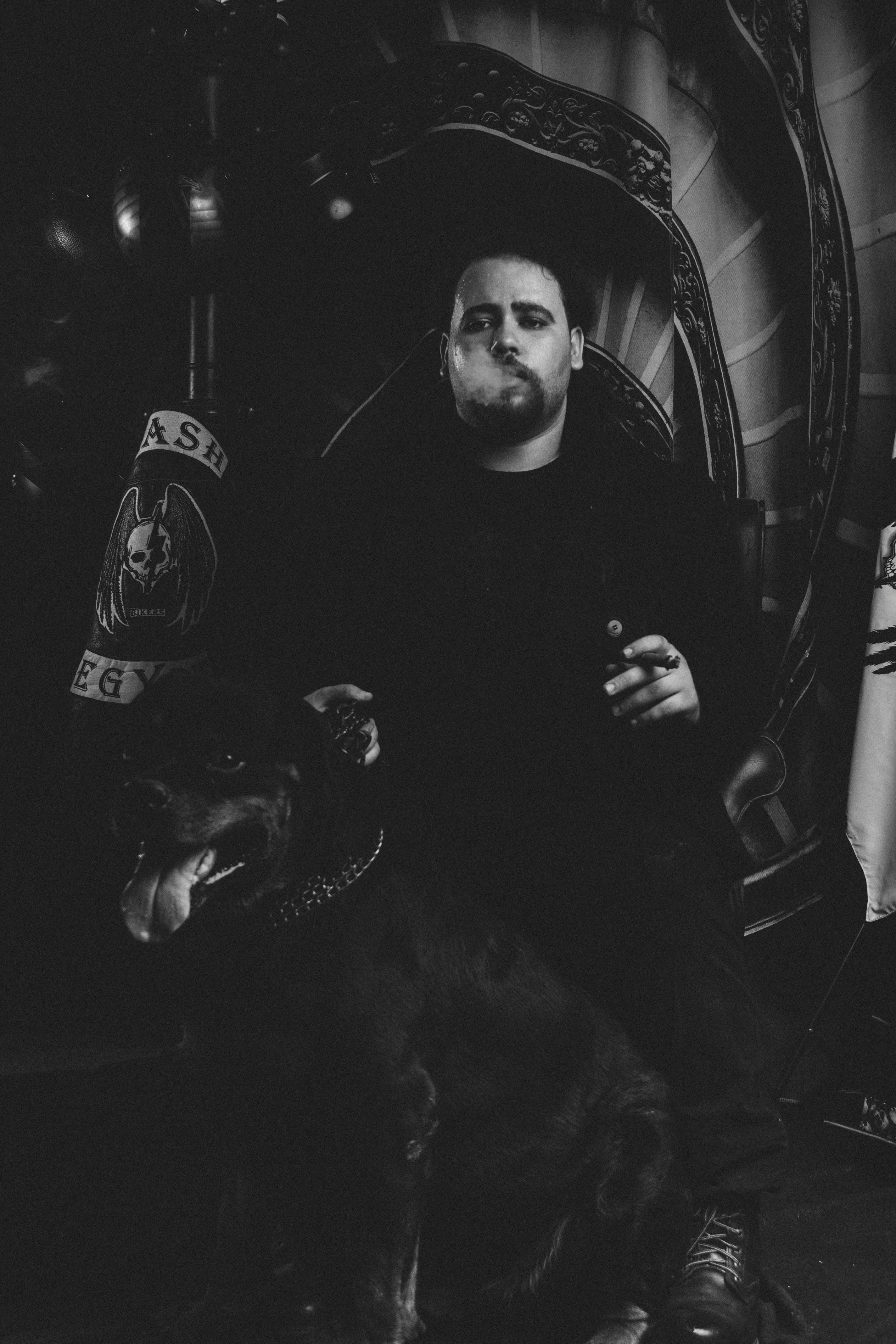 A man sitting on a couch with a dog