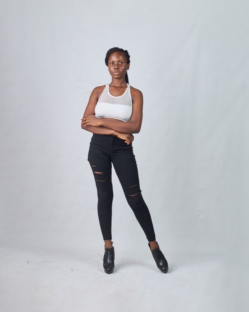 Free Stylish portrait of a young black woman in fashion wear, showcasing elegance and confidence. Stock Photo