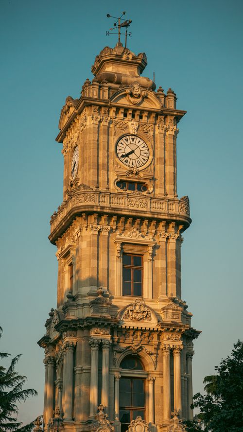 Free The picturesque Ottoman-style clock tower standing tall during sunset. Stock Photo