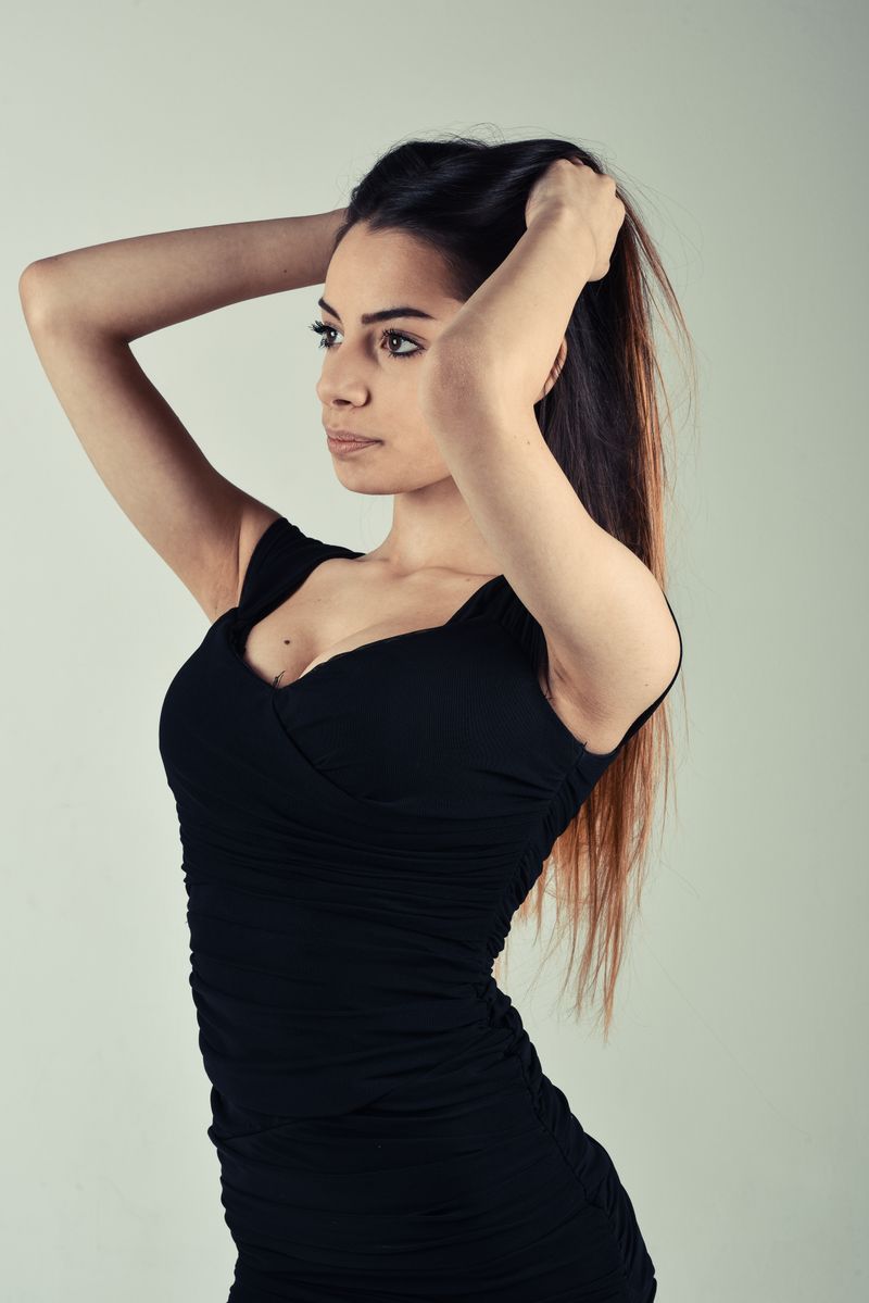 Back View of a Sexy Woman Wearing Black Dress · Free Stock Photo