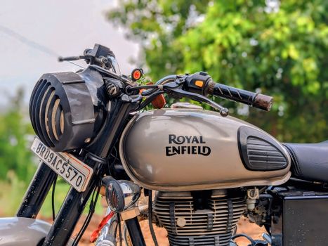 Close-up of a vintage Royal Enfield motorcycle showcasing chrome and classic design.