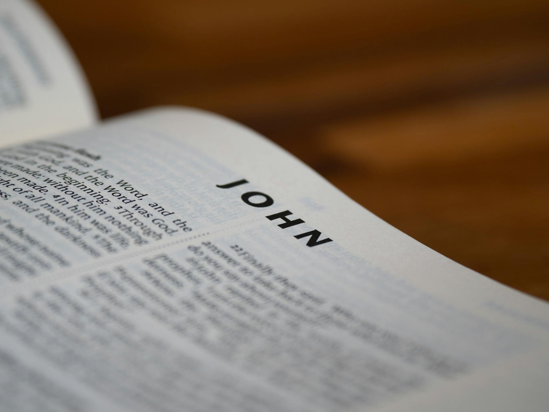 A bible open with the word john on it