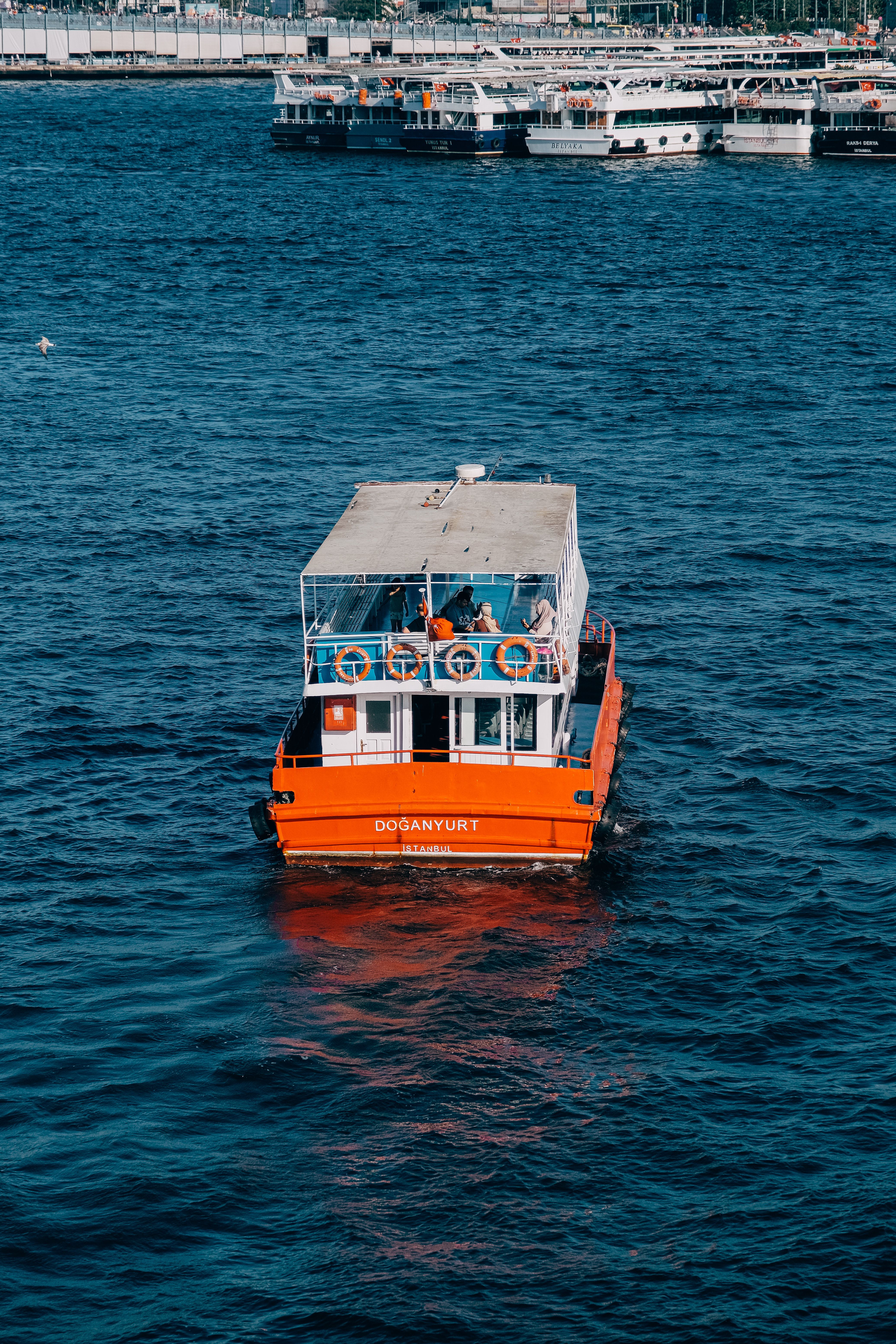 A boat in the water with people on it · Free Stock Photo