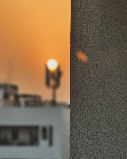 Free Sunset, framed by wall Stock Photo