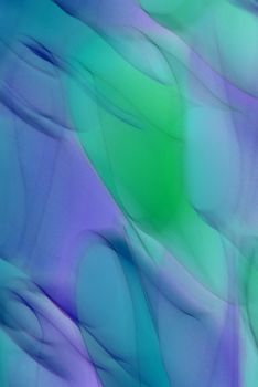 Vibrant abstract pattern with smooth gradations of blue, green, and purple hues.