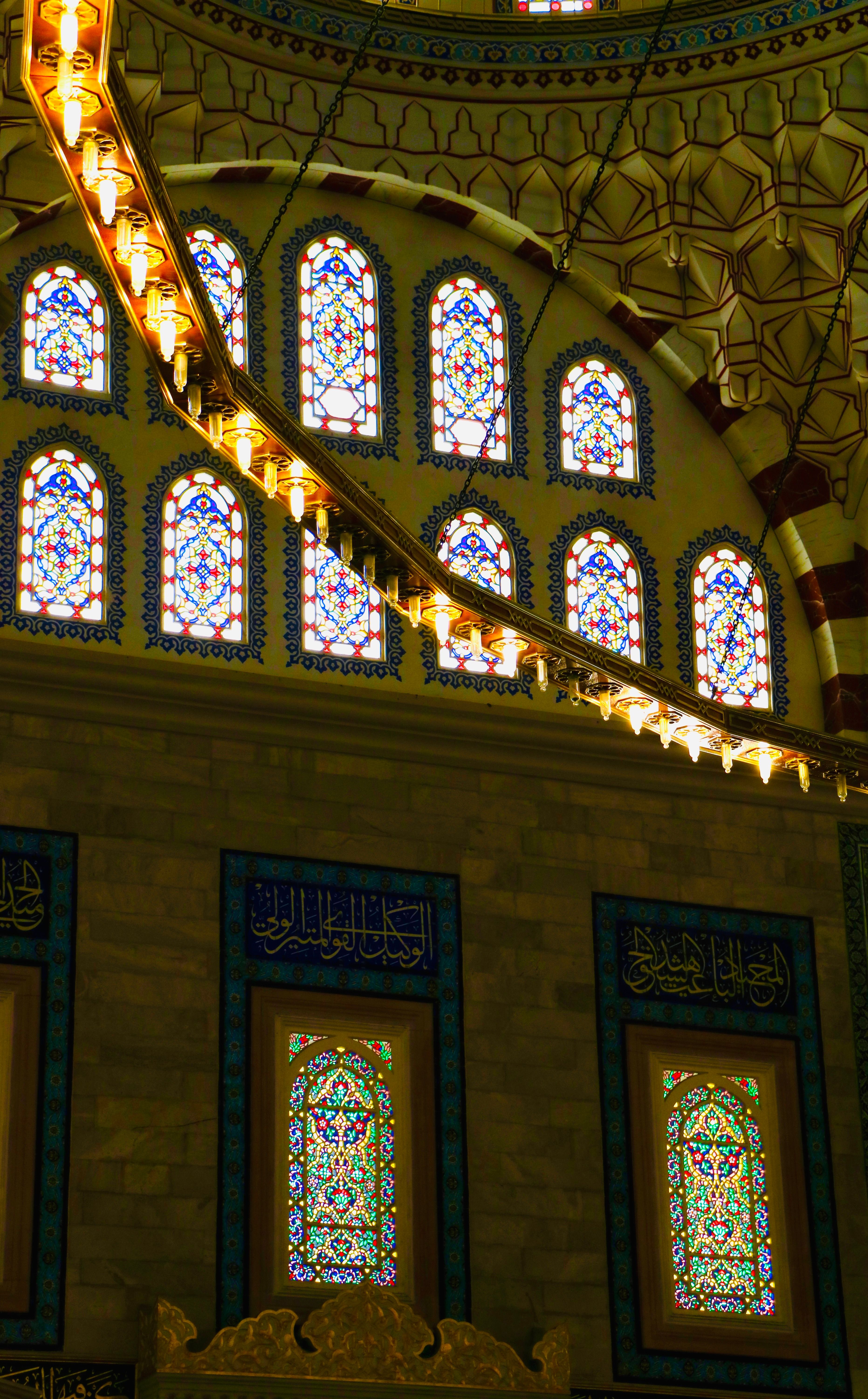 A large stained glass window in a mosque · Free Stock Photo