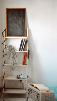 A stylish bookshelf with books and decor in a modern room setting, evoking minimalism.