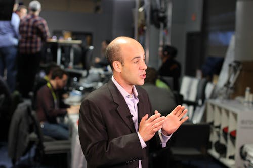 Man Facing Side With Hand Raise on Chest Level