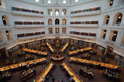 Free Captured inside Melbourne's renowned library, showcasing its vast architecture and reading areas. Stock Photo