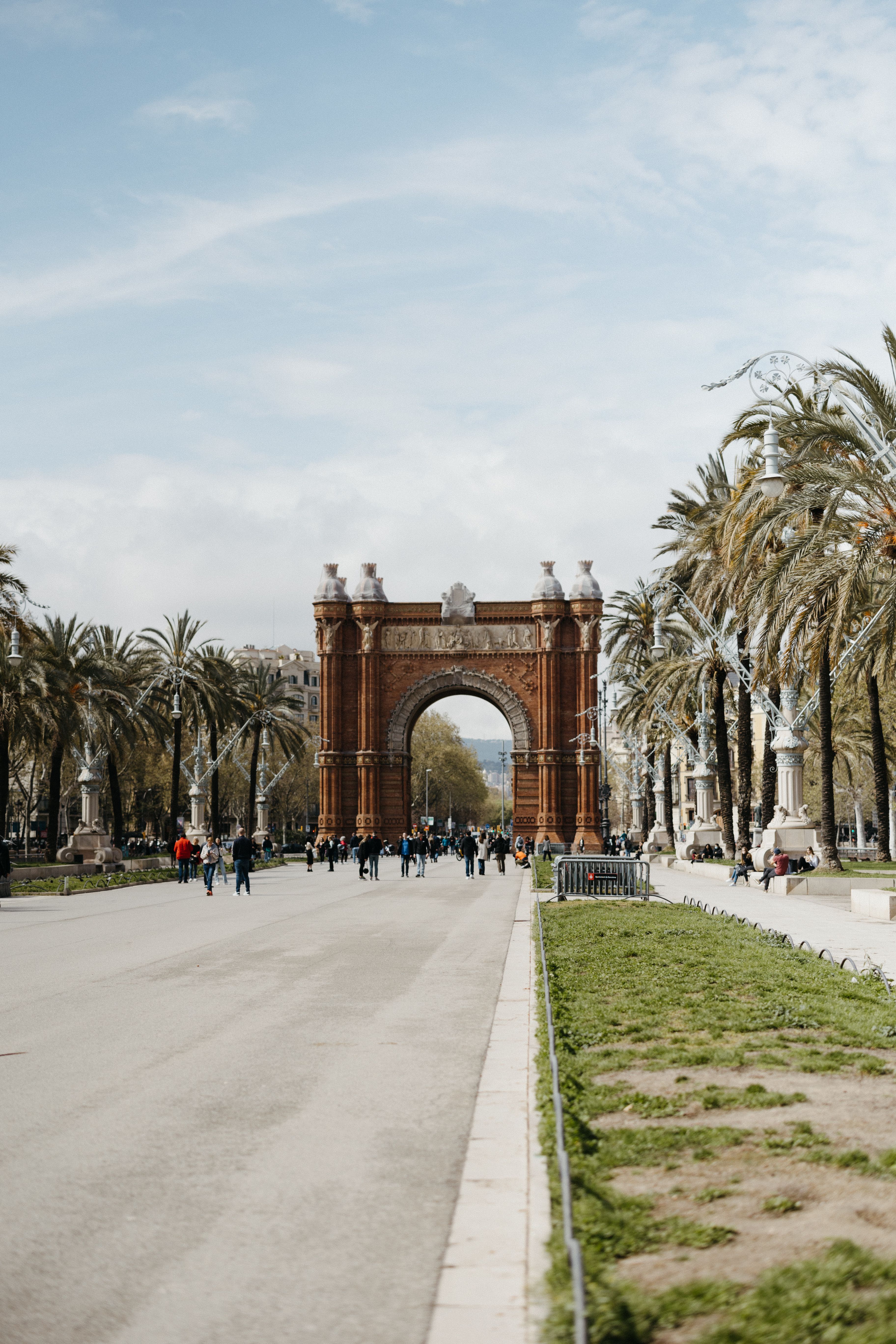 Arc de Triomf framed by palms in Barcelona