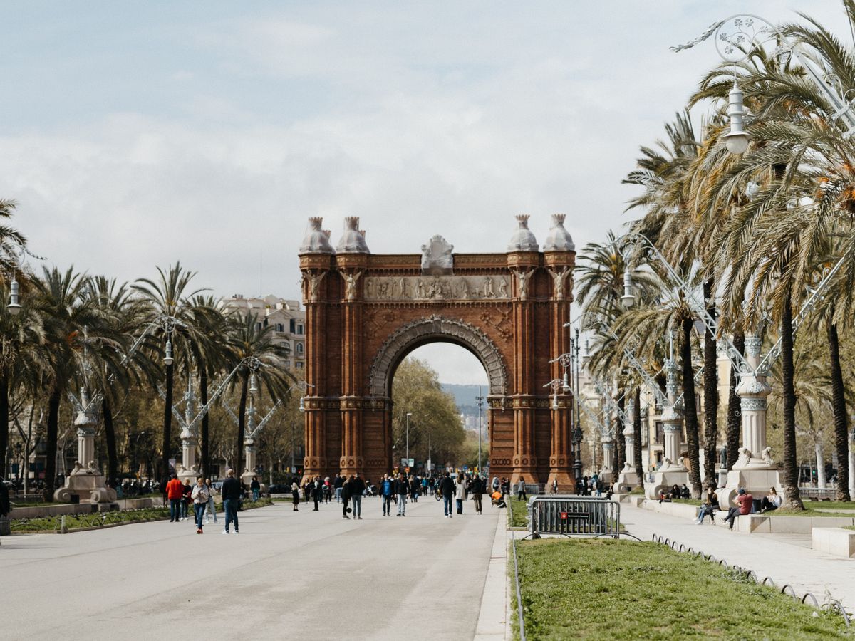 Arc de Triomf framed by palms in Barcelona
