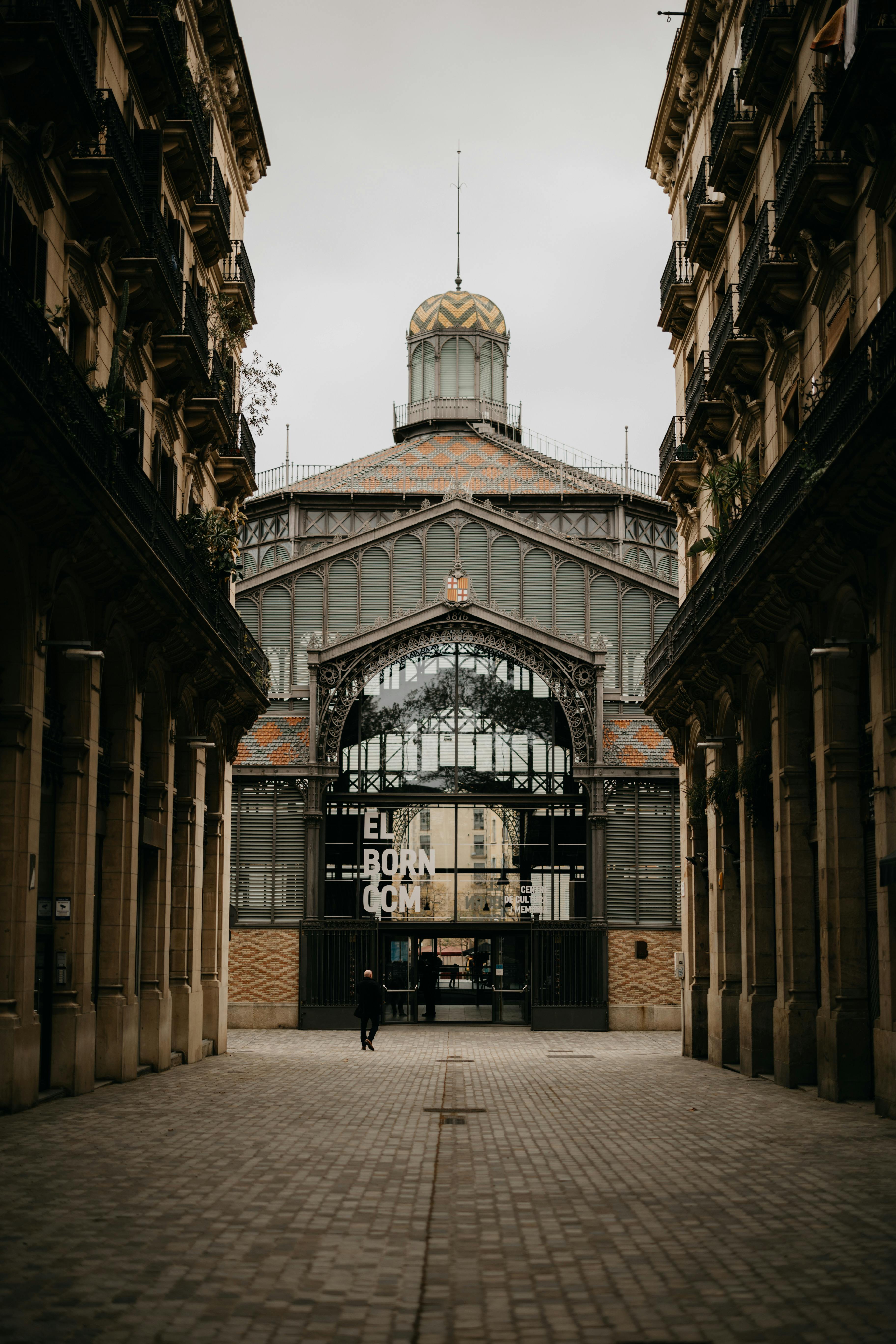 a man walking through an empty street in a city