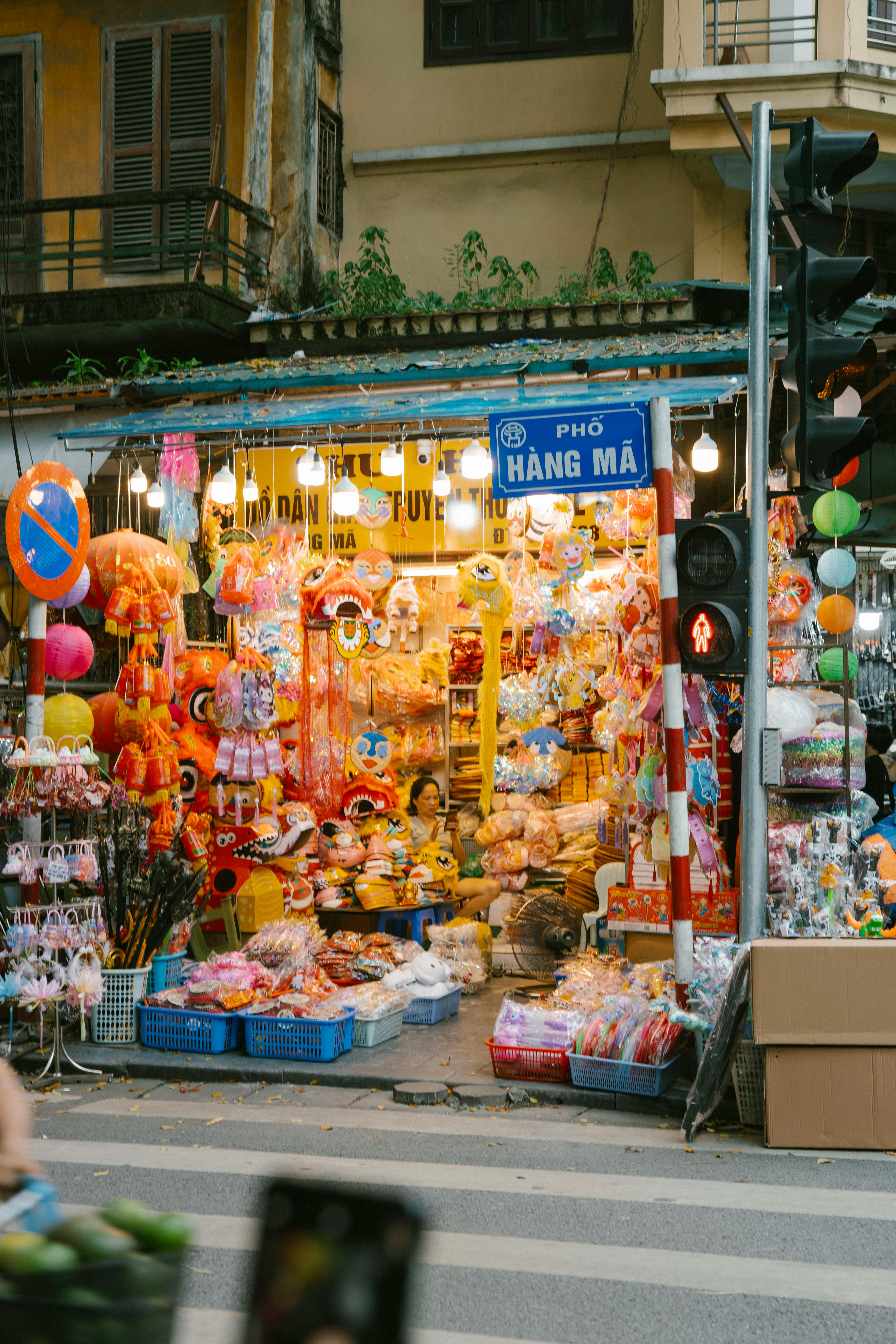 a street with a store selling toys and other items