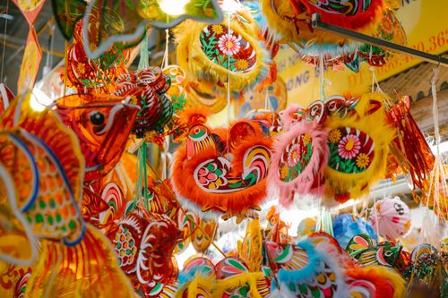 Free Colorful traditional festive decorations hanging in a vibrant display. Stock Photo