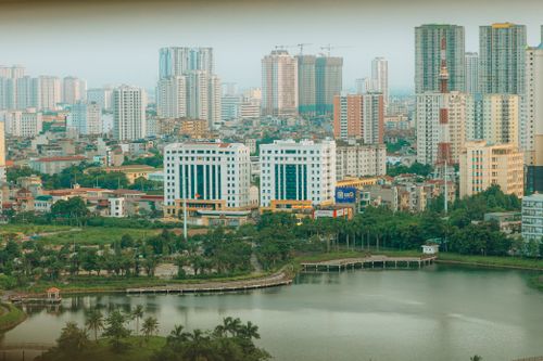 Free A bustling city skyline with modern buildings and waterfront view, showcasing urban life and architecture. Stock Photo