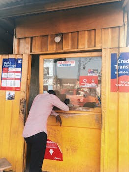 Man engaging with a street vendor in Accra, showcasing local commerce.