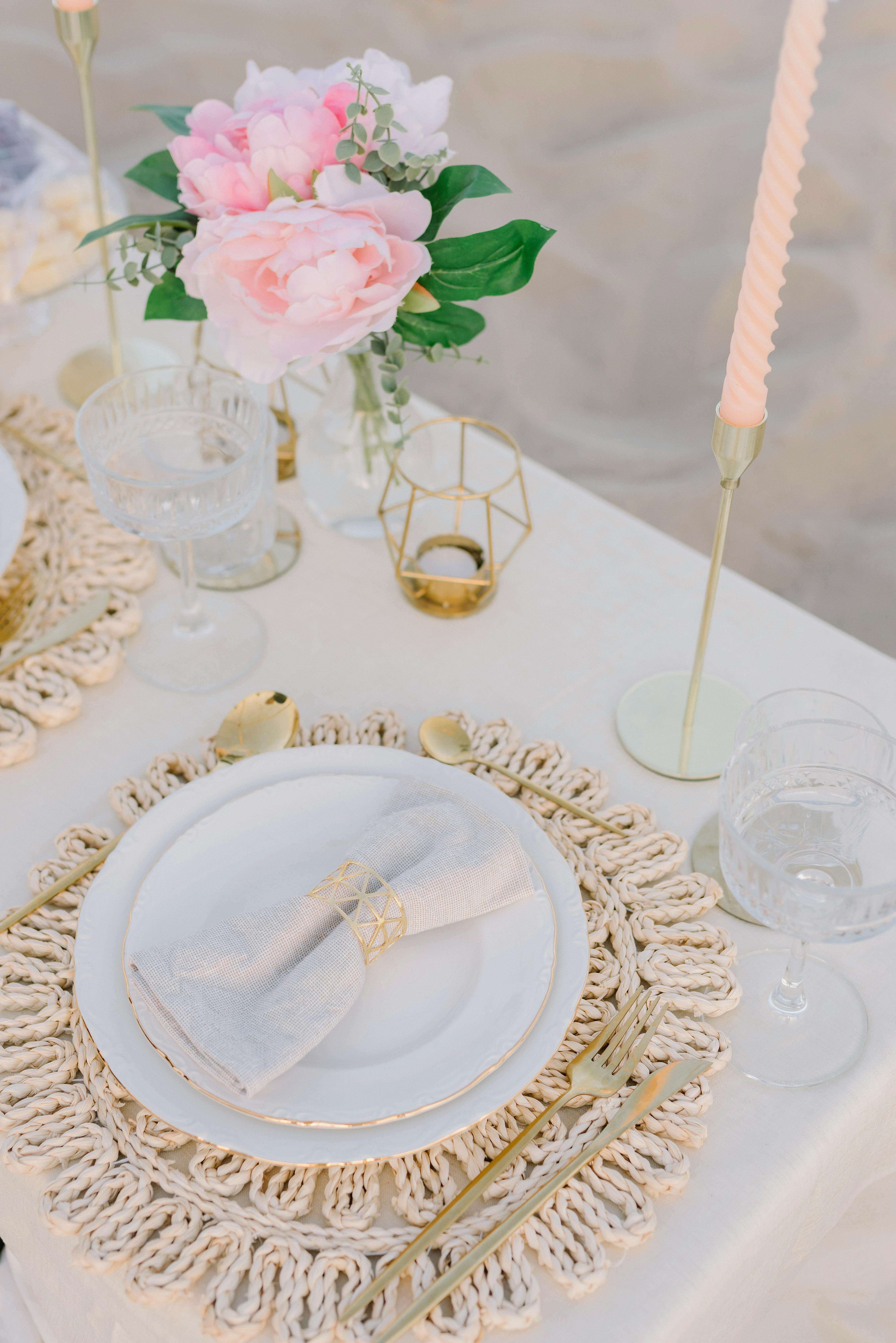 Beautifully arranged table setting for a romantic wedding with elegant floral decor.