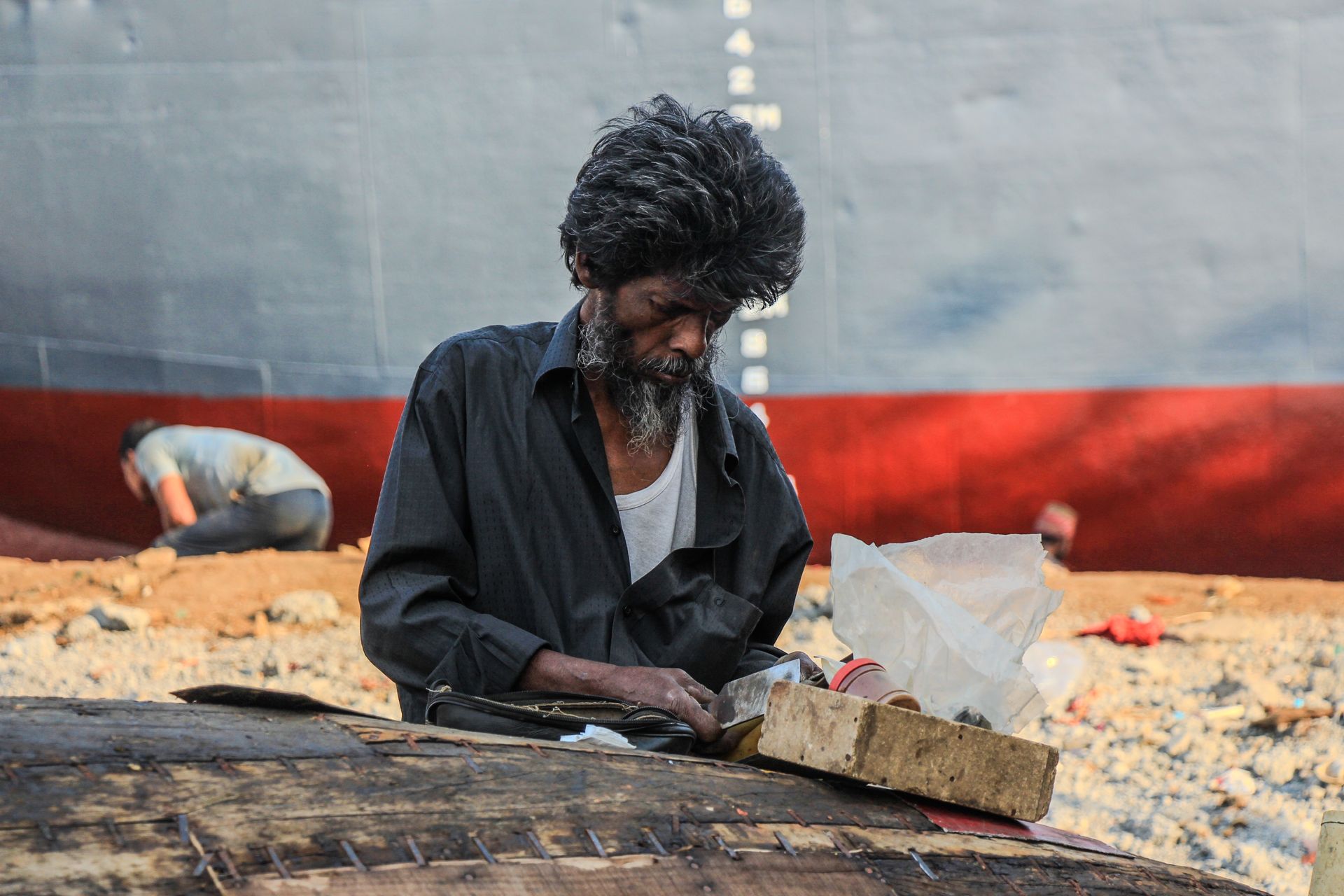 Portrait of a skilled artisan working near a shipyard, showcasing dedication and craftsmanship.