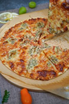 Appetizing homemade Margherita pizza with cheesy toppings, freshly baked and ready to eat.
