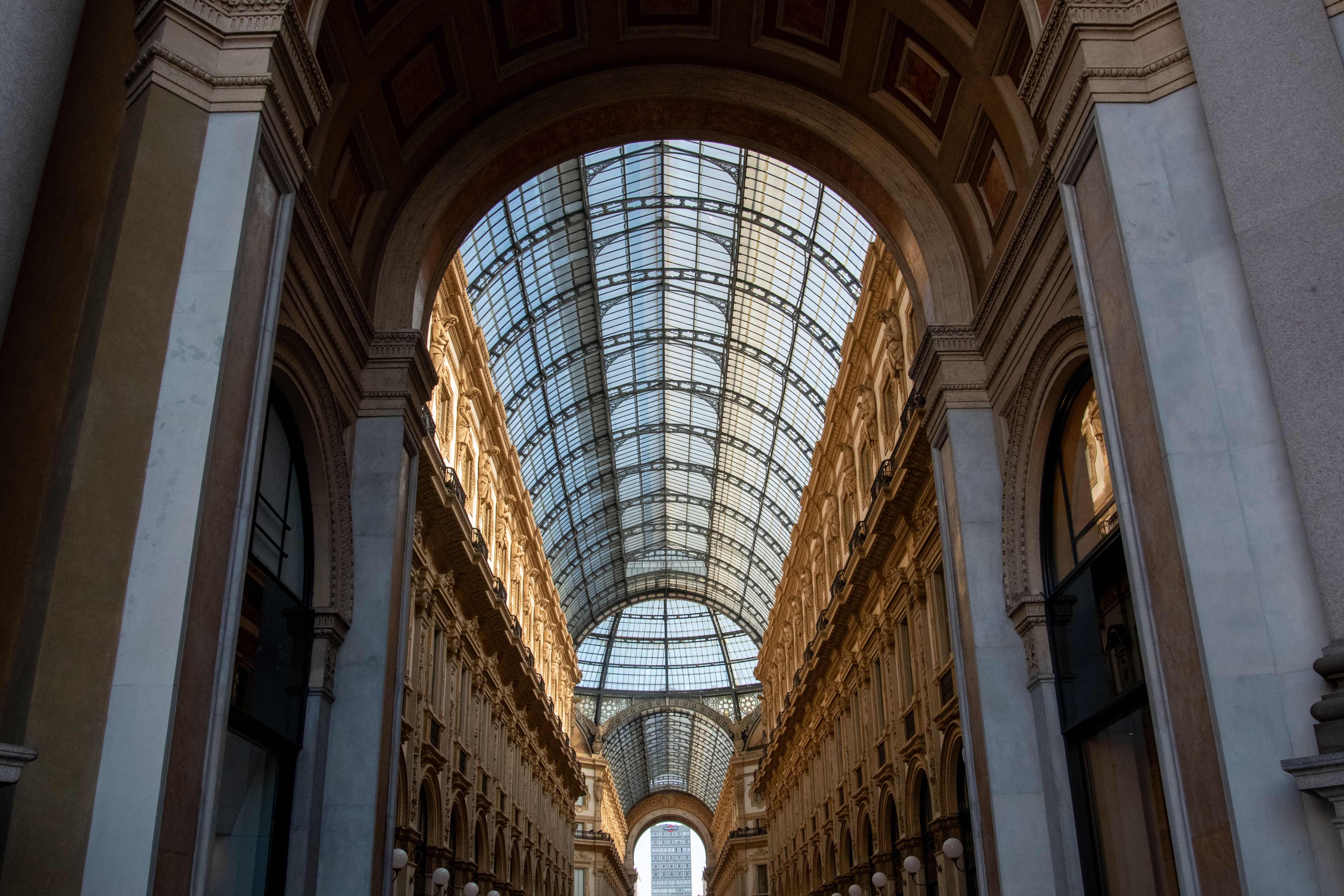 The inside of a building with a glass roof · Free Stock Photo