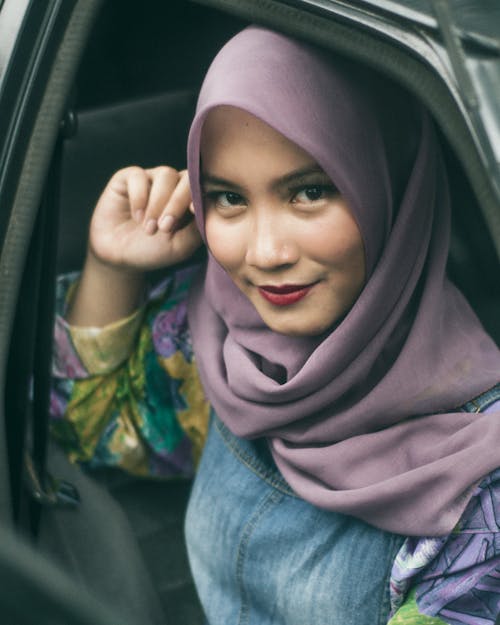 Woman Taking Selfie Inside Vehicle