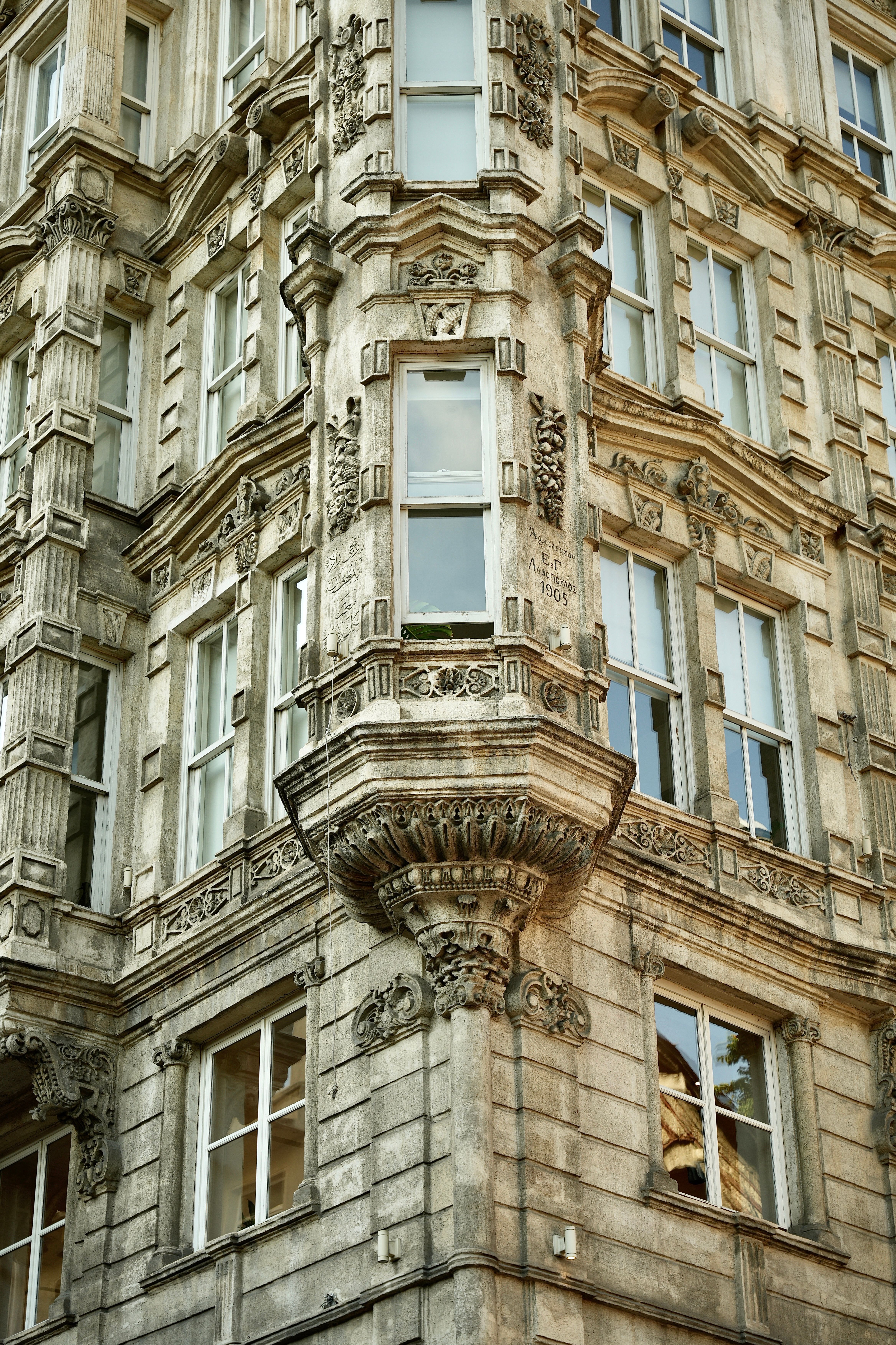 A tall building with ornate windows and balconies · Free Stock Photo