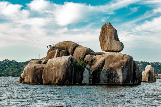 Iconic Bismarck Rock formation in Lake Victoria, Mwanza, Tanzania, under a bright summer sky.