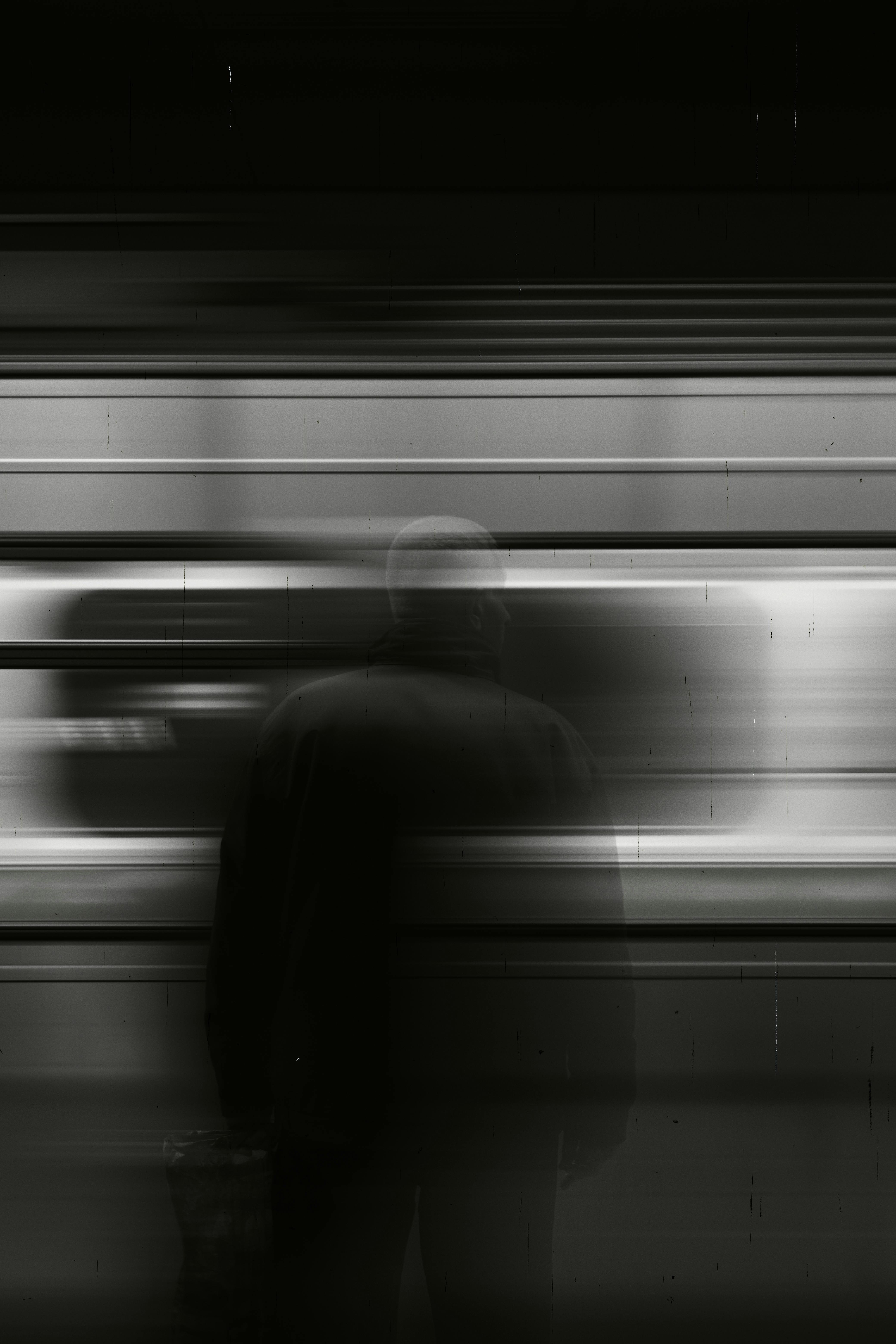 Free Artistic capture of a subway station with motion blur creating a mysterious atmosphere. Stock Photo