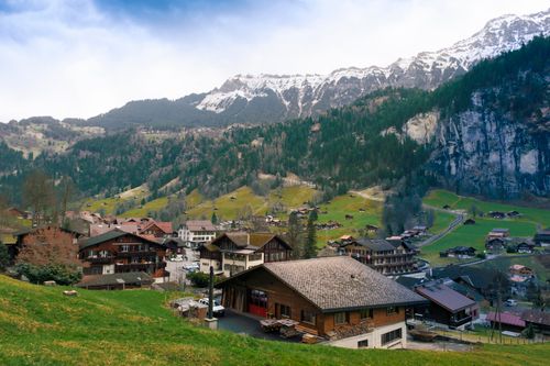 Free Explore the picturesque village of Lauterbrunnen in Switzerland, surrounded by stunning alpine scenery and lush greenery. Stock Photo