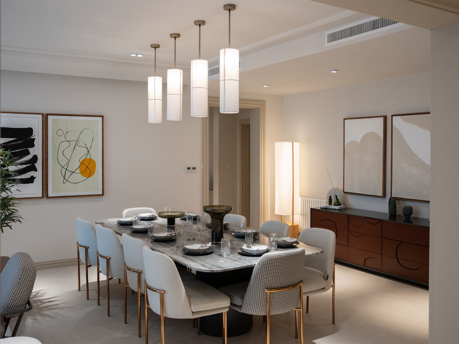 Elegantly composed contemporary dining setting with muted tones and natural ceramics