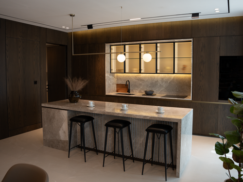 Free Modern kitchen design featuring a marble island and sleek cabinetry. Stock Photo