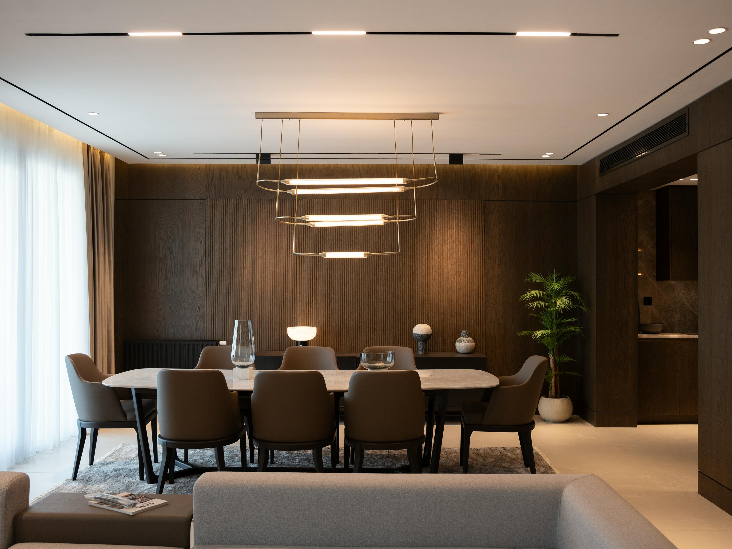 Dining room with dark wood finishes and statement lighting - Traditional home decor ideas