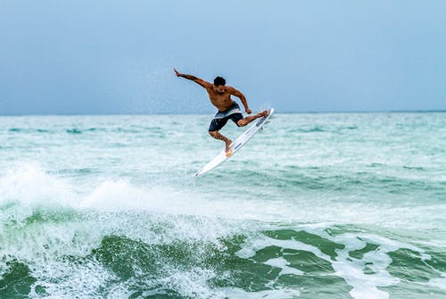 Free Man Surfing  Stock Photo