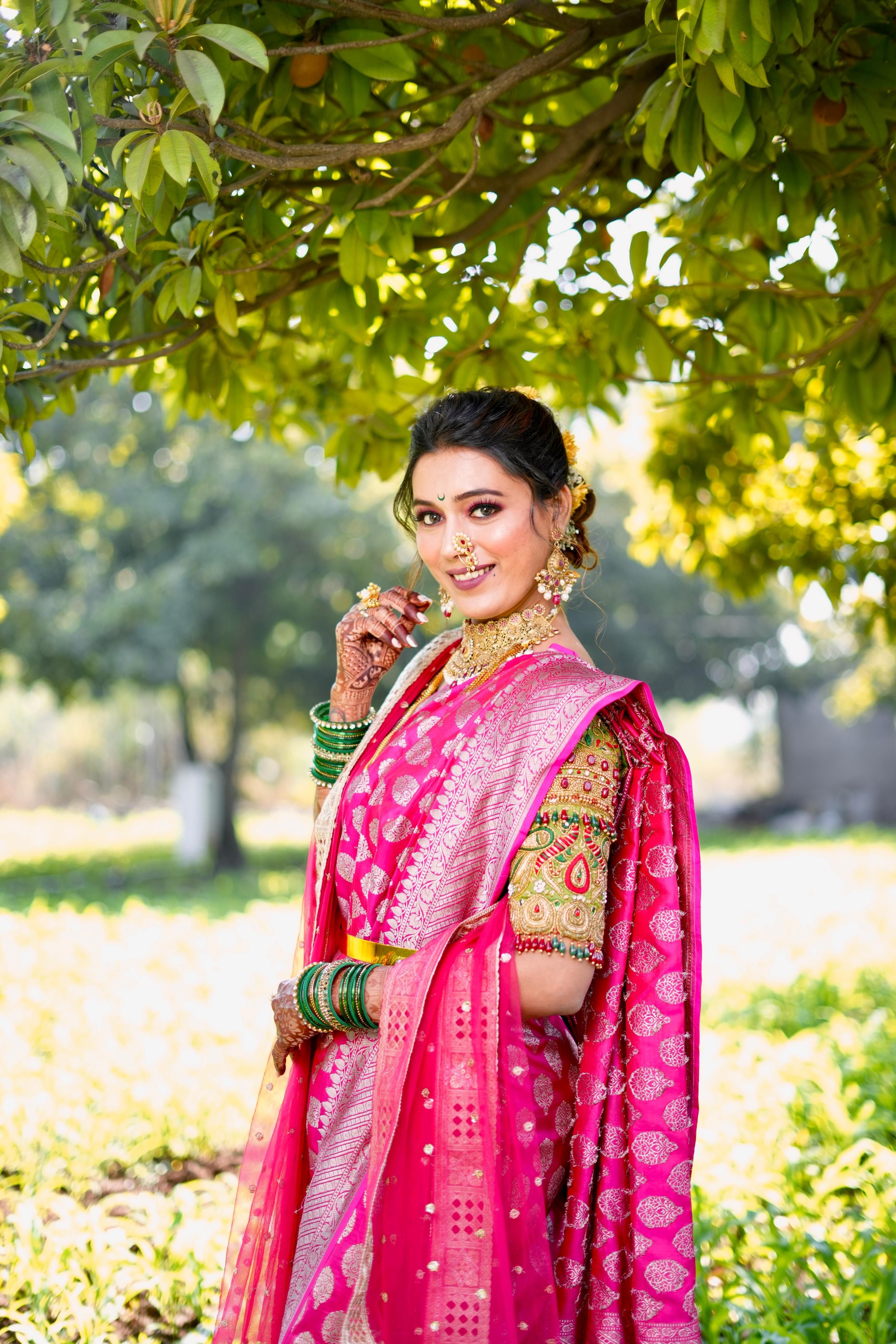 A beautiful woman in a pink sari posing for the camera · Free Stock Photo