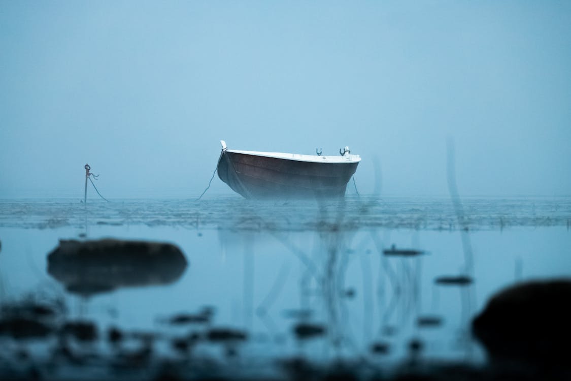 Free Boat Anchored in Water Stock Photo