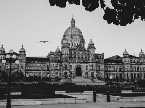 Black and white photo of the Parliament Building in Victoria, BC, showcasing its historic architecture.