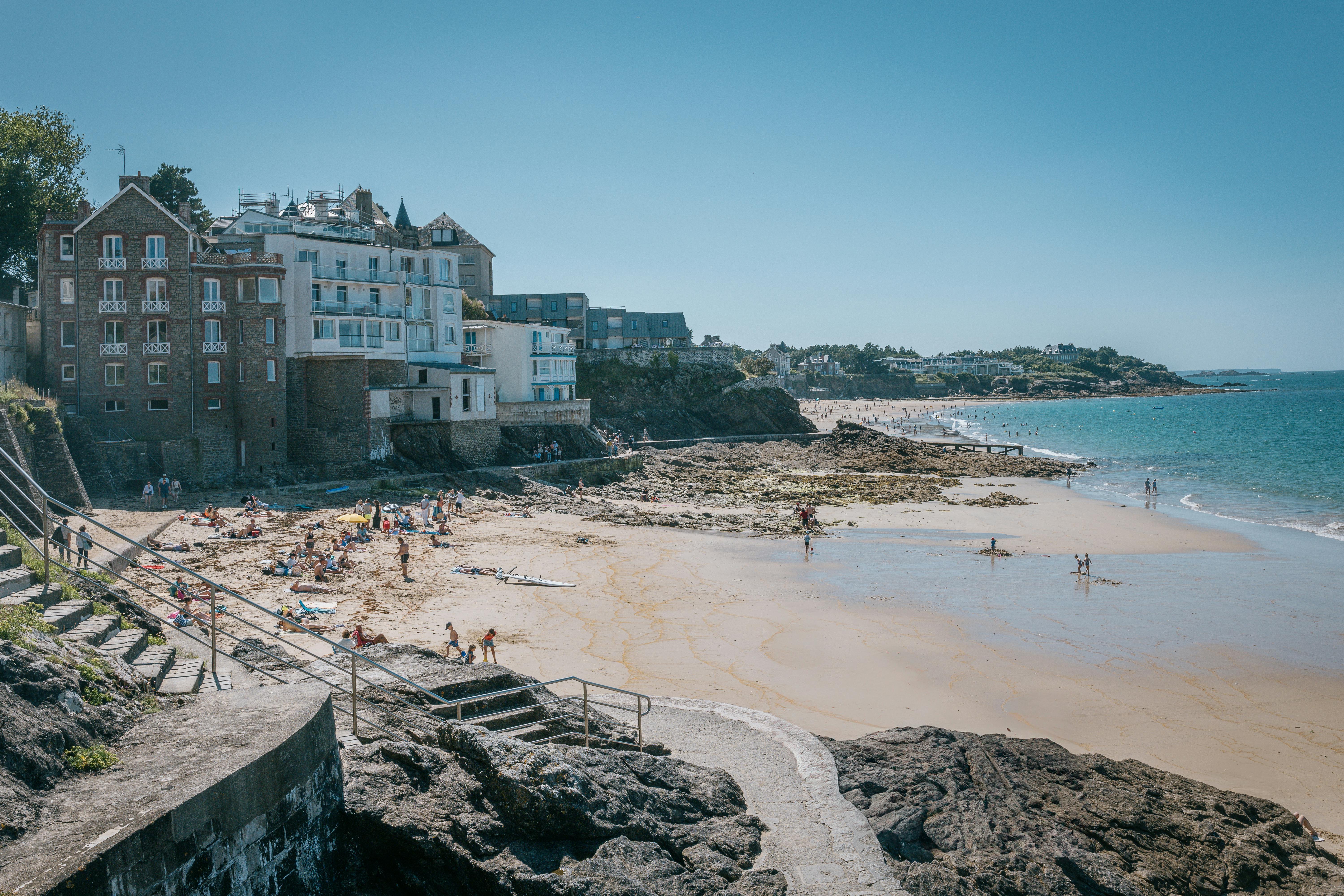 Dinard beaches with golden sand, turquoise waters, and Belle Époque villas under soft Breton morning light in Brittany, France
