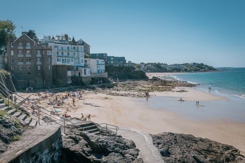 Free A picturesque summer day at the beach in Dinard, France, showcasing charming architecture and a vibrant seaside scene. Stock Photo