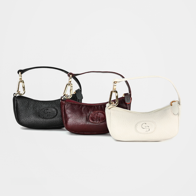 Chic leather handbags in black, wine red, and beige, perfect for elegant style.