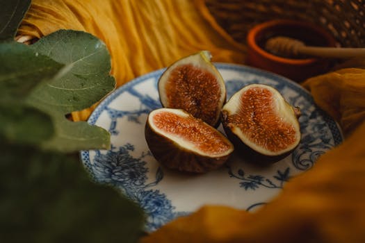 Moody still life of fresh figs on a decorative plate, perfect for food photography.
