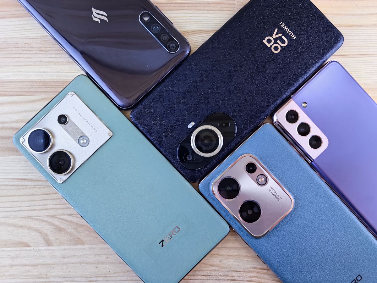 Assortment of modern smartphones arranged for evaluation